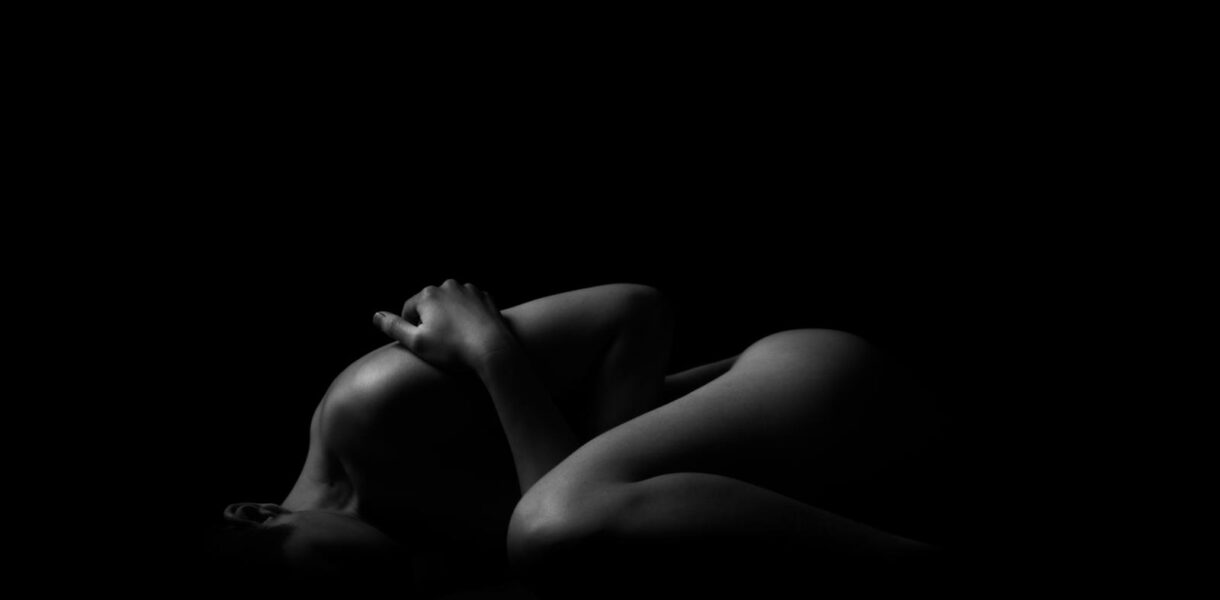 Grayscale Photo of a Woman Sleeping